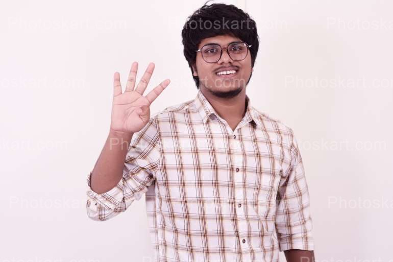 Indian Boy Showing Fingers Premium Image