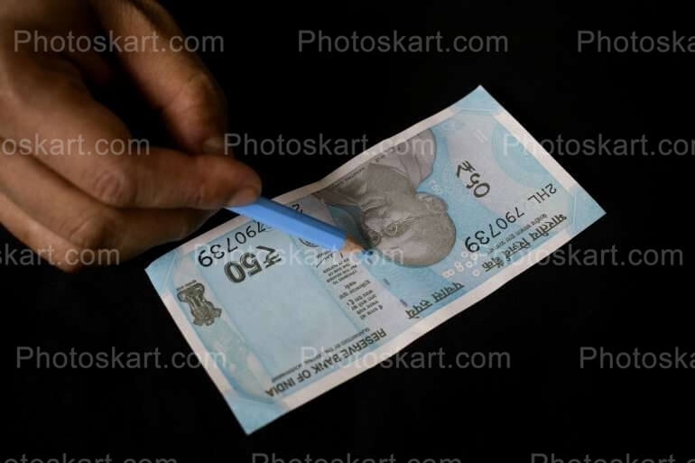 One Fifty Rupees Note With Pen Free Stock Image