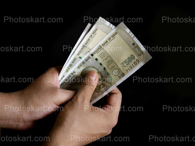 Three Five Hundred Note Holding By Hand Image